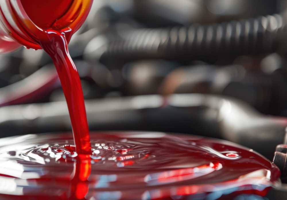 The red oil being poured